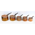 A group of five 19th century copper saucepans and matching covers, of graduating size, largest 45.5 ... 
