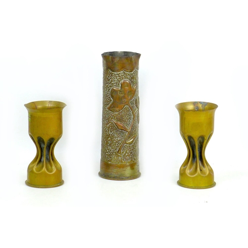 103 - Three WWI trench art shell case vases, comprising a vase with single flower motif, made from a 1917,... 