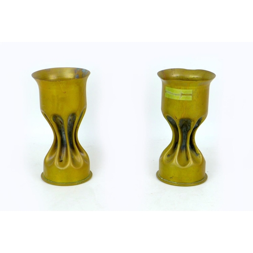 103 - Three WWI trench art shell case vases, comprising a vase with single flower motif, made from a 1917,... 