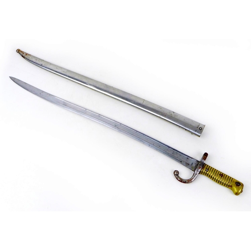 108 - A French 1874 pattern bayonet and scabbard, with hooked quillon guard, brass grip, 'Mre. d'Armes de ... 