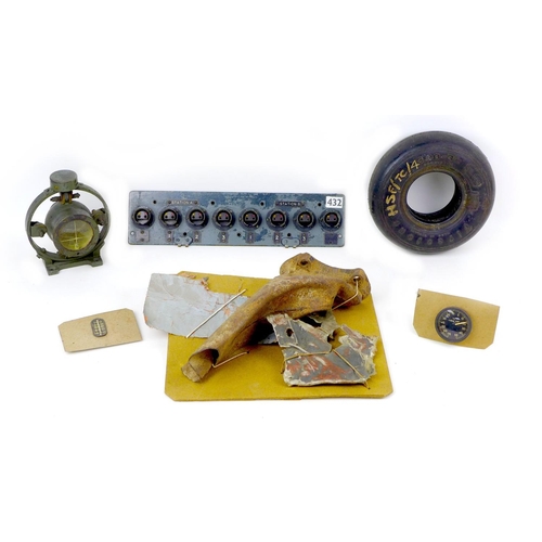 124 - A collection of unidentified WWII aircraft relics, including an Allied control panel with labelled '... 