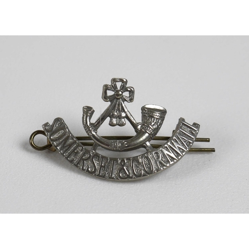 140 - A collection of British Army regimental badges, including Cornwall, Somerset and Cornwall, Paddingto... 