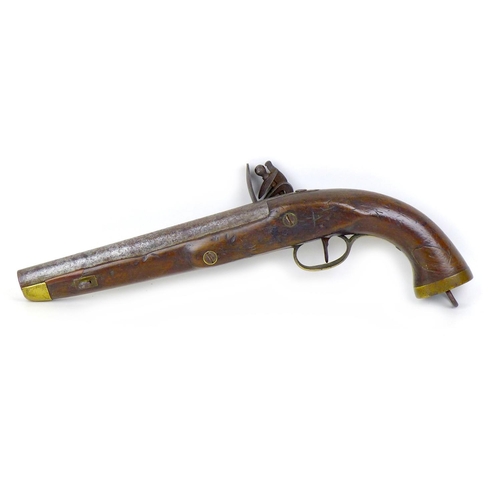 144 - An 18th century flintlock pistol, no visible maker's name, with walnut stock, white metal and brass ... 