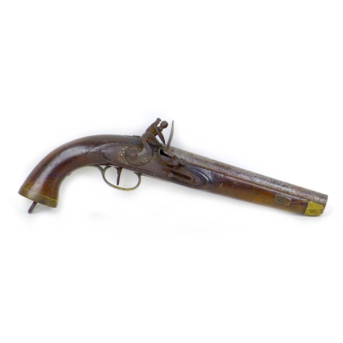 144 - An 18th century flintlock pistol, no visible maker's name, with walnut stock, white metal and brass ... 