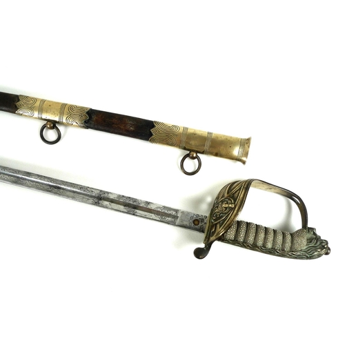 167 - A Naval Officer's dress sword, with wire bound shagrin locking grip, with lion's head pommel, the bl... 