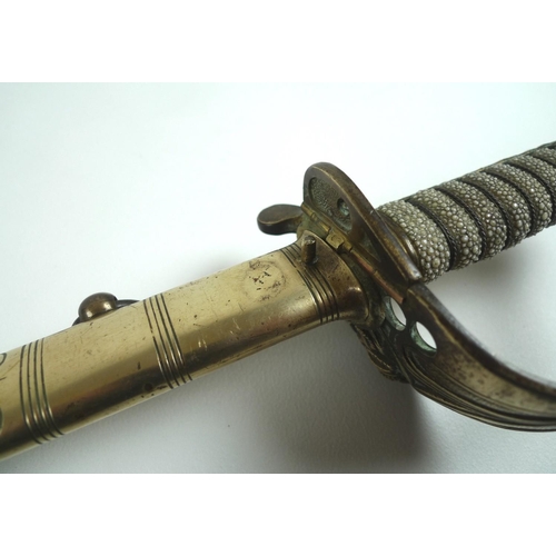 167 - A Naval Officer's dress sword, with wire bound shagrin locking grip, with lion's head pommel, the bl... 