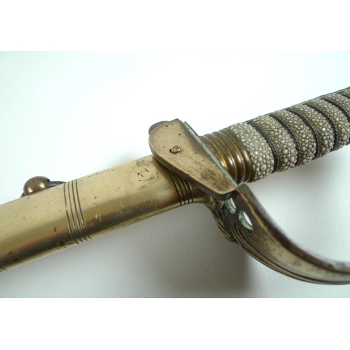 167 - A Naval Officer's dress sword, with wire bound shagrin locking grip, with lion's head pommel, the bl... 