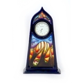 A rare Moorcroft Jacaranda pattern table clock, the first trial piece (out of two trial pieces) to h... 