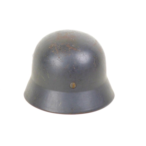 171 - A WWII era German Luftwaffe steel helmet, with leather lining and chin strap, its aluminium internal... 