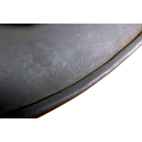 171 - A WWII era German Luftwaffe steel helmet, with leather lining and chin strap, its aluminium internal... 