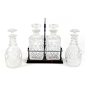 Two pairs of cut glass decanters, comprising a Victorian pair with ovoid bodies and mushroom stopper... 