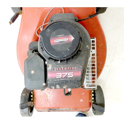 213 - A Champion 375 petrol lawnmower, with Briggs & Stratton engine, red with black grass box.
Notes: not... 