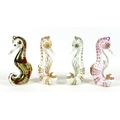 A group of four Royal Crown Derby paperweights, all modelled as seahorses, comprising 'Pink Seahorse... 