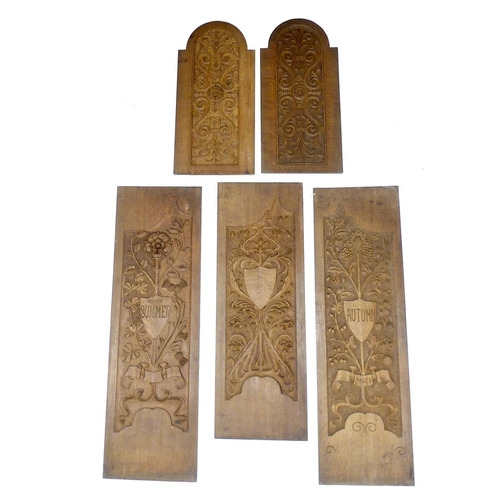 221 - A group of five partially carved panels, three larger with central shields named 'Summer' and 'Autum... 