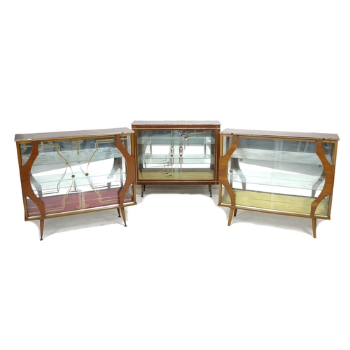 231 - A group of three retro glazed display cabinets, circa 1950's, each with sliding doors and glass shel... 