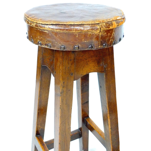 232 - Three vintage oak bar stools, with leather upholstered seats, 30 by 30 by 76cm high. (3)