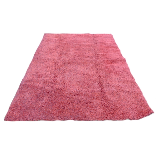 238 - A large contemporary 'Opus Shaggy' rug, with crimson ground, 245 by 345cm.