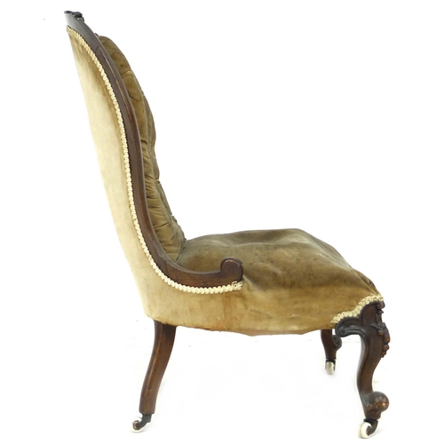 244 - A Victorian button back nursing chair, with walnut carved top-rail, upholstered in olive velvet, 75 ... 