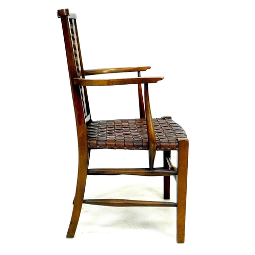 249 - A mahogany open armchair, circa 1940, with four shaped splats, the seat formed of lattice woven stri... 