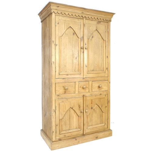 257 - A modern pine cupboard, in Victorian style, with twin cupboard doors opening to reveal a single shel... 