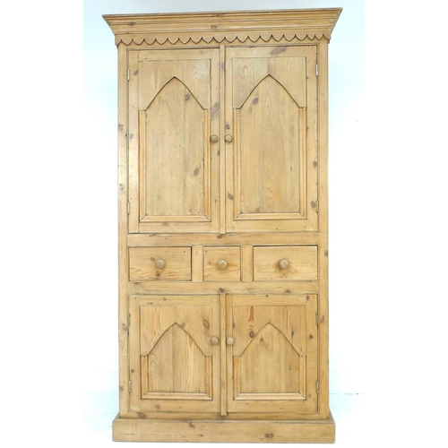 257 - A modern pine cupboard, in Victorian style, with twin cupboard doors opening to reveal a single shel... 