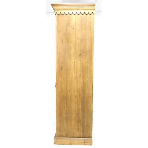 257 - A modern pine cupboard, in Victorian style, with twin cupboard doors opening to reveal a single shel... 