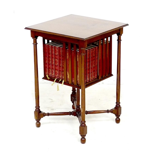 259 - A mahogany side table with revolving bookcase below, the square surface with moulded edge, raised on... 