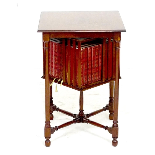 259 - A mahogany side table with revolving bookcase below, the square surface with moulded edge, raised on... 