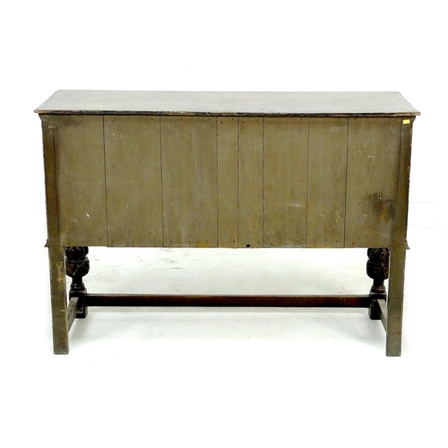 273 - An Old Charm dark stained sideboard, with carved decoration, two central drawers flanked by two cupb... 