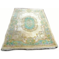 A large modern wool carpet, cream and pale coloured decoration, 361 by 271.5cm.
