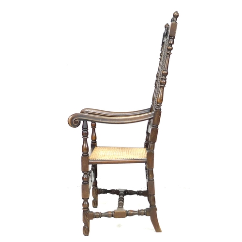 285 - A walnut 17th century style armchair, with carved decoration and caned seat and back, 59 by 66 by 13... 