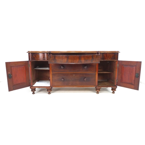 287 - A Victorian mahogany sideboard, with serpentine front, drawers flanked by two cupboards enclosing sh... 