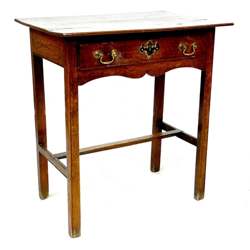 288 - A Georgian oak low boy, with single drawer above a shaped apron, raised upon square sectioned legs w... 