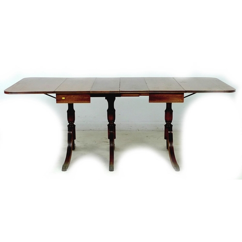 301 - A Regency style mahogany sofa / dining table, circa 1970, of unusual form with drop leaves and exten... 