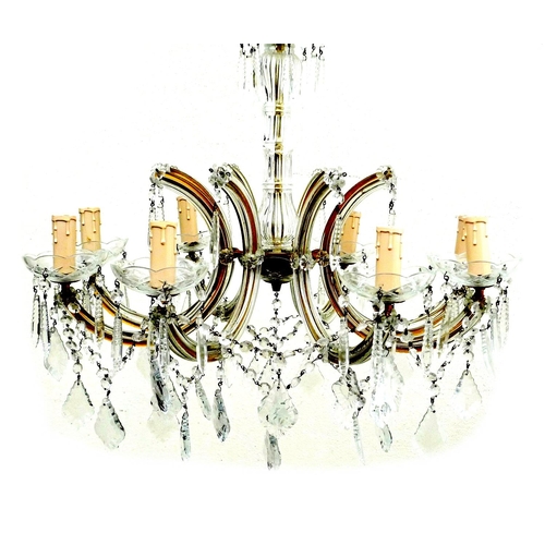 306 - A glass and brass eight branch chandelier, with cut glass droplets, 60 by 52cm high.