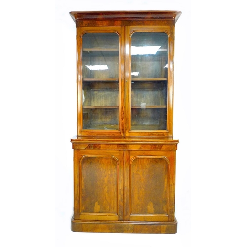 308 - A Victorian mahogany and walnut veneered bookcase, twin glazed doors enclosing three shelves, twin a... 