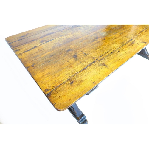 310 - A 19th century stained pine refectory table, with good patination, and X frame end supports, approxi... 