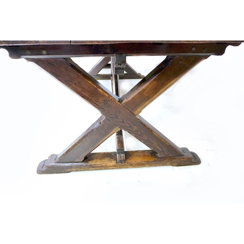 310 - A 19th century stained pine refectory table, with good patination, and X frame end supports, approxi... 