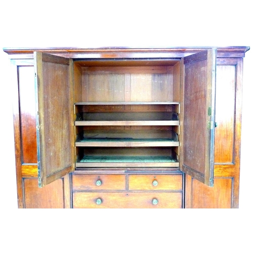 313 - A Victorian mahogany compactum wardrobe, with two full length panelled doors enclosing hanging space... 