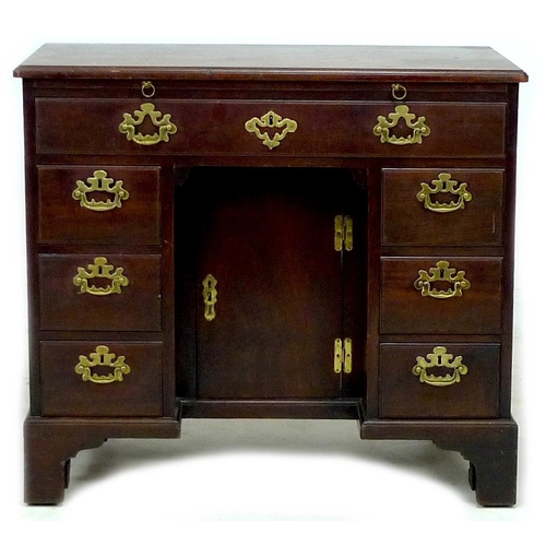 315 - A George III mahogany kneehole desk, with pull out slide, long drawer over central recess with cupbo... 