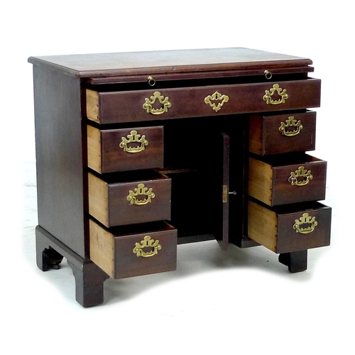 315 - A George III mahogany kneehole desk, with pull out slide, long drawer over central recess with cupbo... 