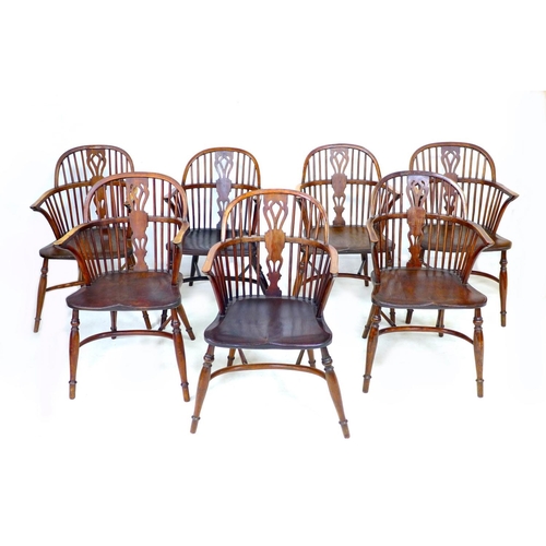 317 - A set of seven early 19th century country made ash and elm Windsor chairs, low spindle backs, turned... 