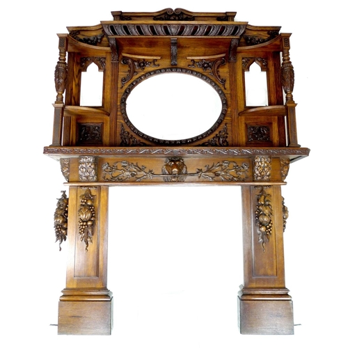 319 - An impressive mid 19th century oak fire surround, with an oval overmantel mirror and two smaller sha... 