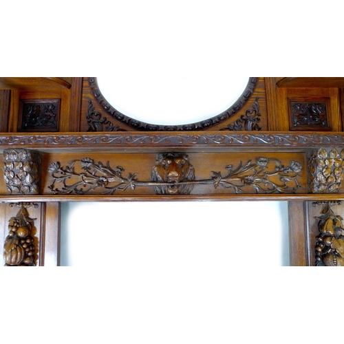 319 - An impressive mid 19th century oak fire surround, with an oval overmantel mirror and two smaller sha... 