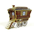 A Royal Crown Derby paperweight, modelled as 'The Ledge Wagon Gypsy Caravan', one of a limited editi... 