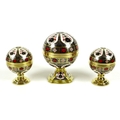 A set of three Royal Crown Derby paperweights, comprising 'Millenium Globe Clock', 'Millenium Globe ... 