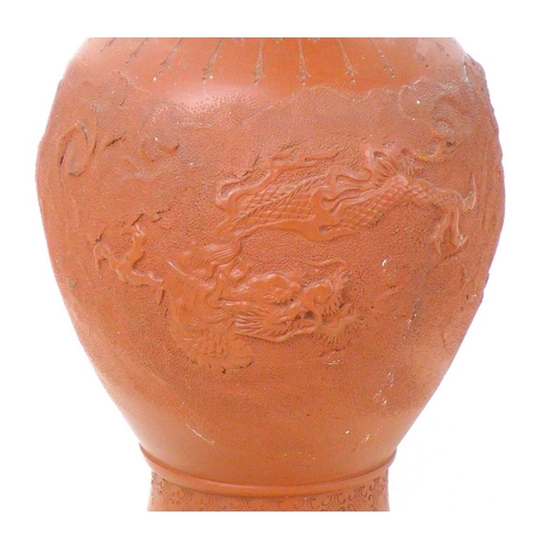 5 - A Chinese Yixing pottery vase, early to mid 20th century, with incised decoration of a dragon amidst... 