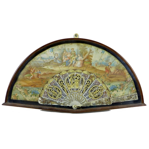 71 - A French or Italian gouache, paper and ivory mounted fan, mid 18th century, the leaf painted with a ... 