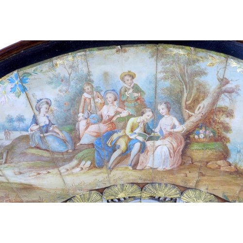 71 - A French or Italian gouache, paper and ivory mounted fan, mid 18th century, the leaf painted with a ... 