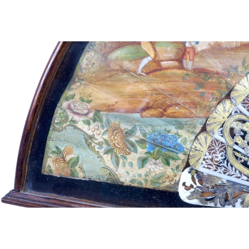 71 - A French or Italian gouache, paper and ivory mounted fan, mid 18th century, the leaf painted with a ... 